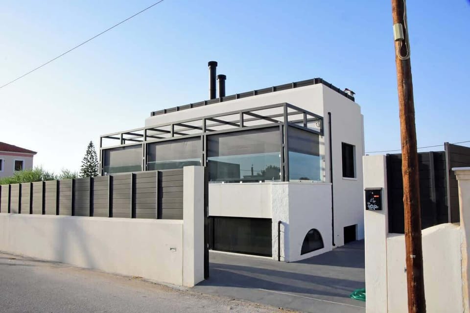Modern two-story residence with sleek architecture and privacy.
Contemporary exterior featuring clean lines, glass accents, and a gated entrance for added comfort!