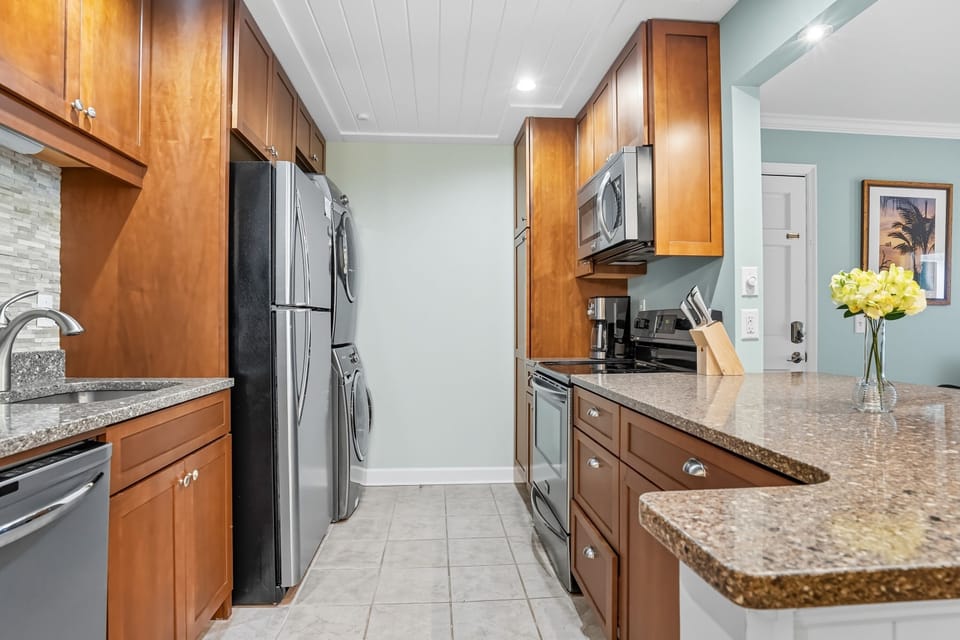 Updated Kitchen Open to the Living Room - Stainless appliances, granite counters, and open sightlines keep meals connected to the main living space.