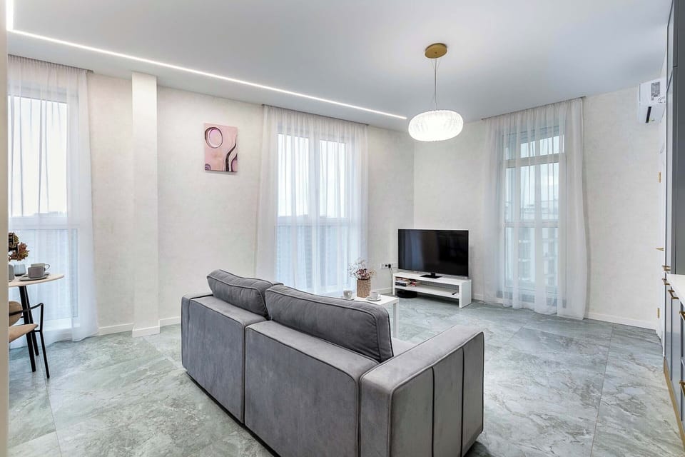 Comfort Apartment | Living area | 40-inch LCD TV with digital channels
