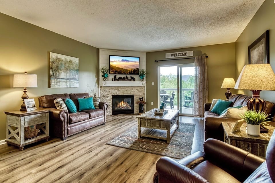 Spacious Living Room with Gas Fireplace, Sleeper Sofa and SMART TV with Cable & WIFI throughout vacation rental
