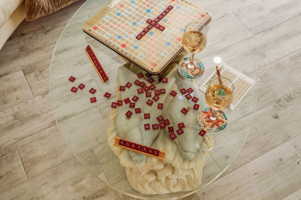 Unwind after a beach day with a glass of wine and a friendly game — cozy nights start here