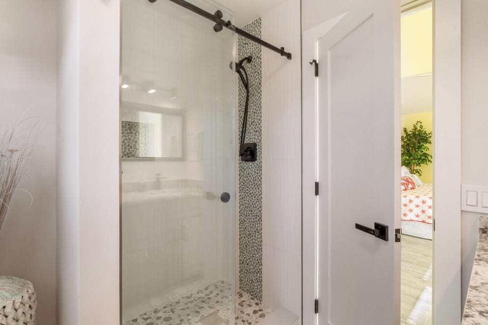 Unwind in your en suite walk-in shower — rinse off the beach and step into relaxation