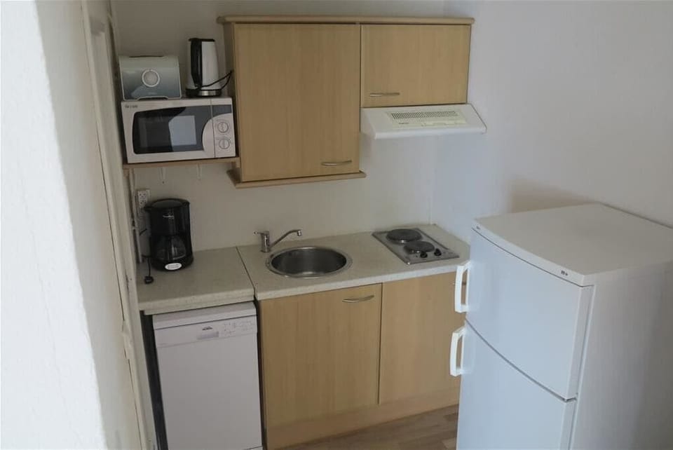 Family Studio, Garden View | Private kitchen | Microwave, coffee/tea maker, electric kettle