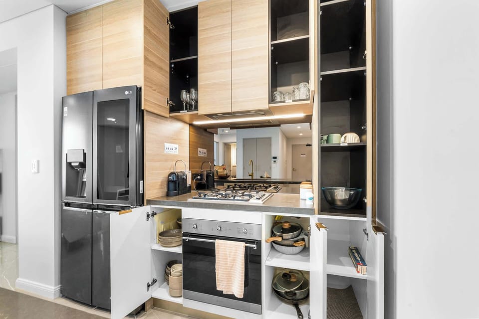Fully equipped kitchen with everything you need — from gas cooktop and oven to quality cookware, glassware, and dinner sets.