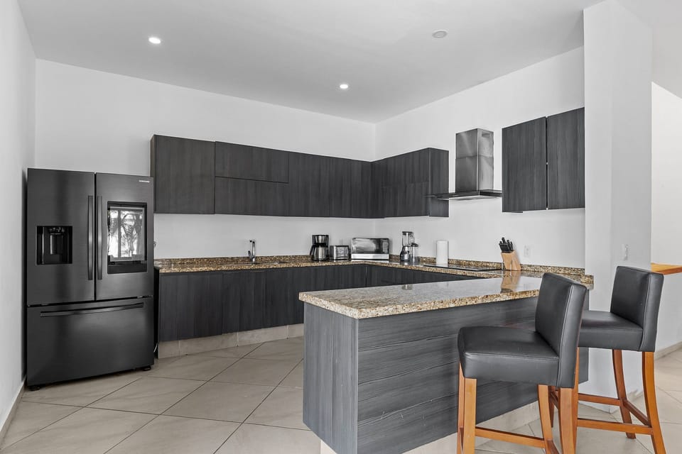 Villa | Private kitchen | Fridge, microwave, oven, stovetop