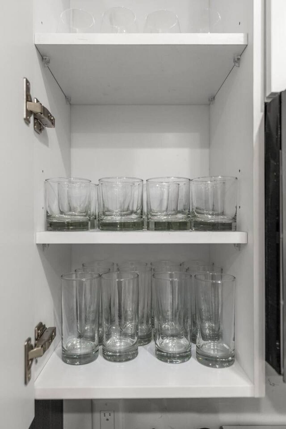 A set of glasses in the kitchen for your drinks.