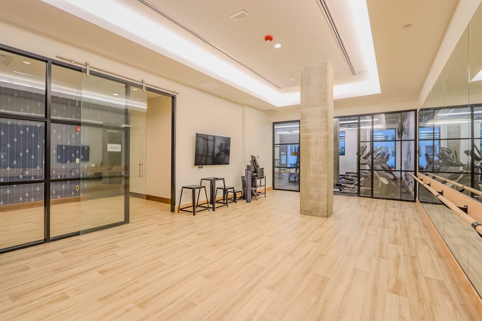Peaceful yoga/barre studio available 24/7 for your wellness routine