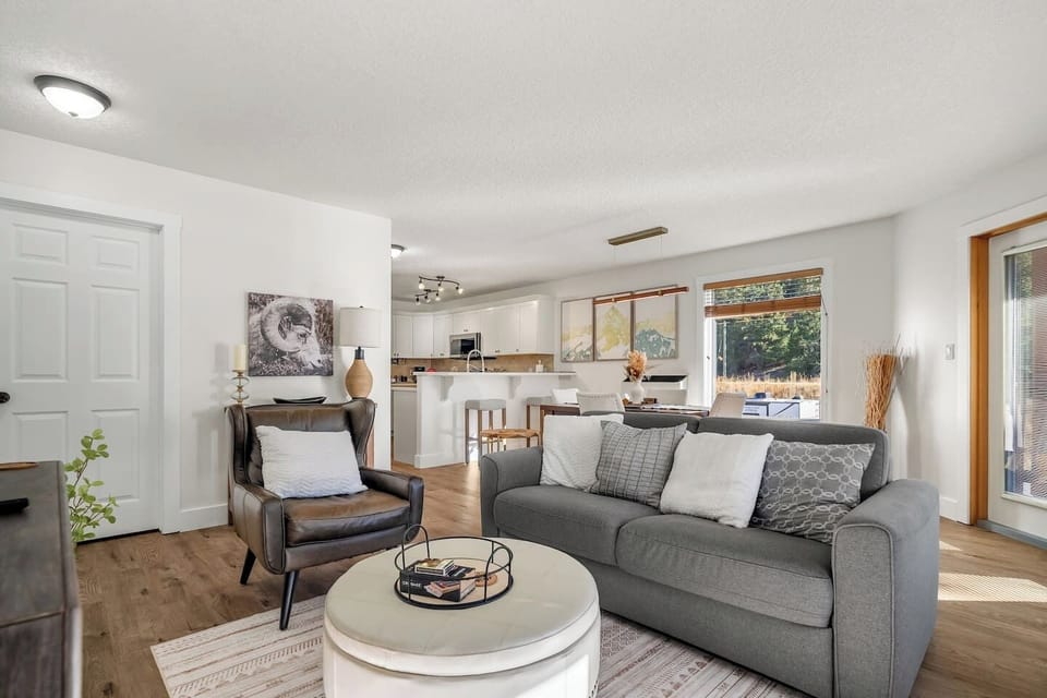 Living room with a wood-burning fireplace, smart TV, board games & cozy seating