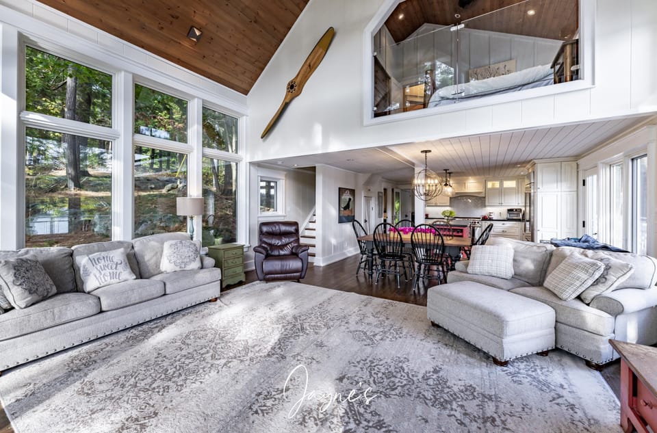 Spacious living room with soaring ceilings and natural light