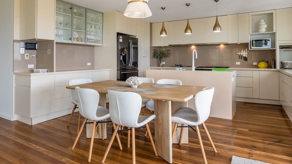 Family dining space with wooden floors