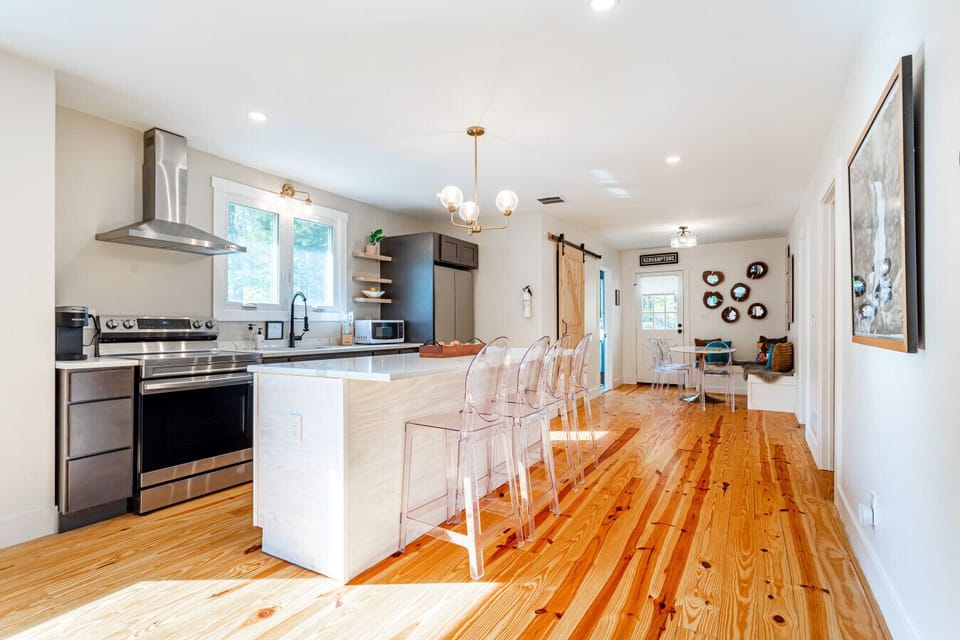 A bright, open kitchen with a stunning island - perfect for cooking, gathering, and entertaining
