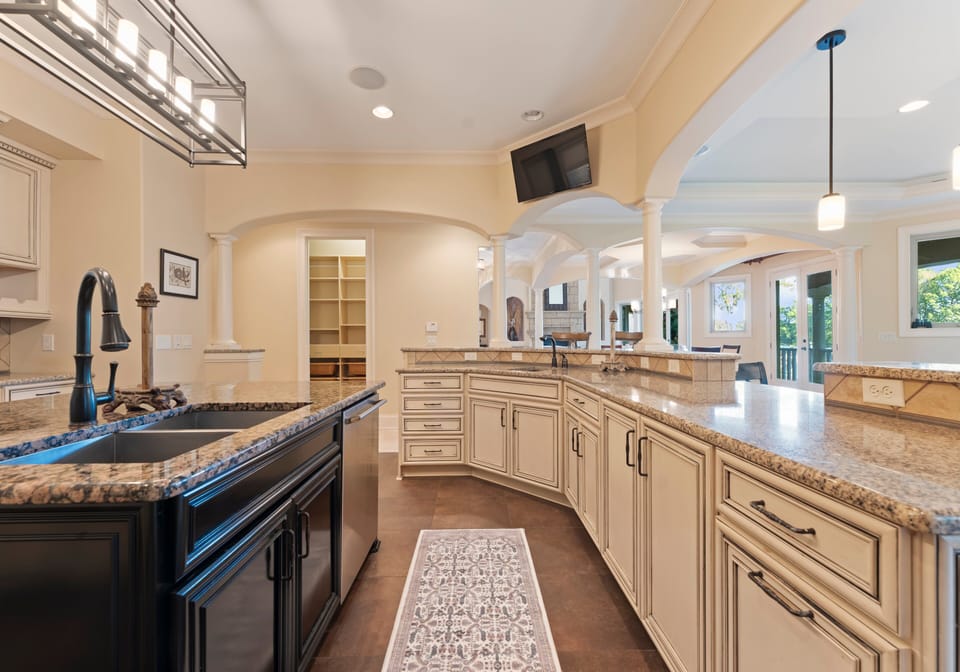 Fully stocked kitchen with island and bar seating.
