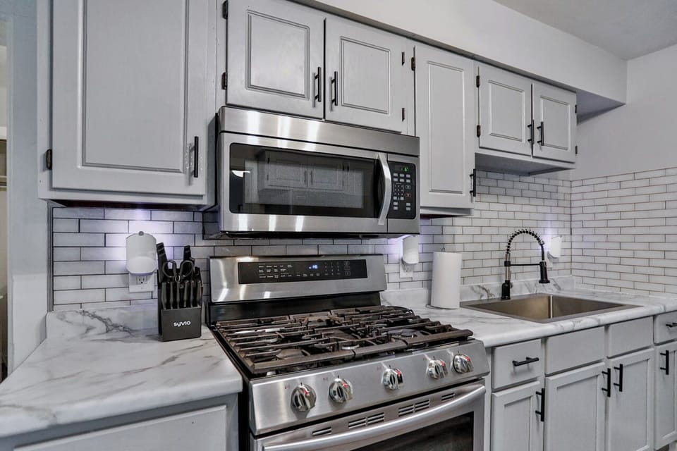 Stylish and functional kitchen with ample cabinetry, sleek appliances, and a convenient layout for everyday cooking.