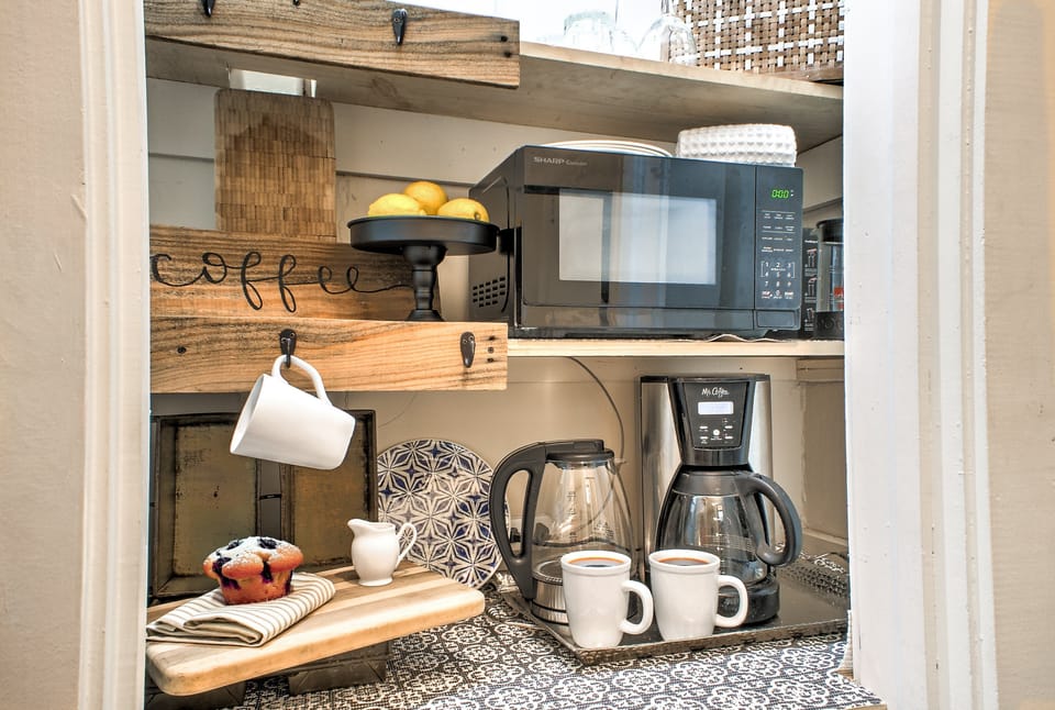 Start your day at the cozy coffee bar — your perfect morning pick-me-up spot.