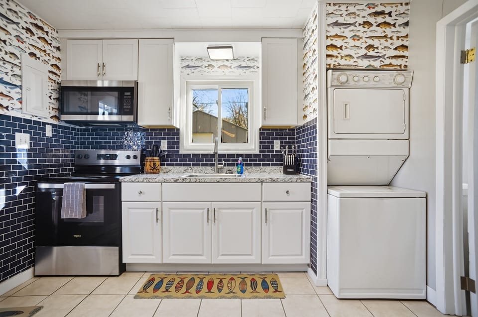 In-kitchen stackable washer and dryer for those longer stays.
