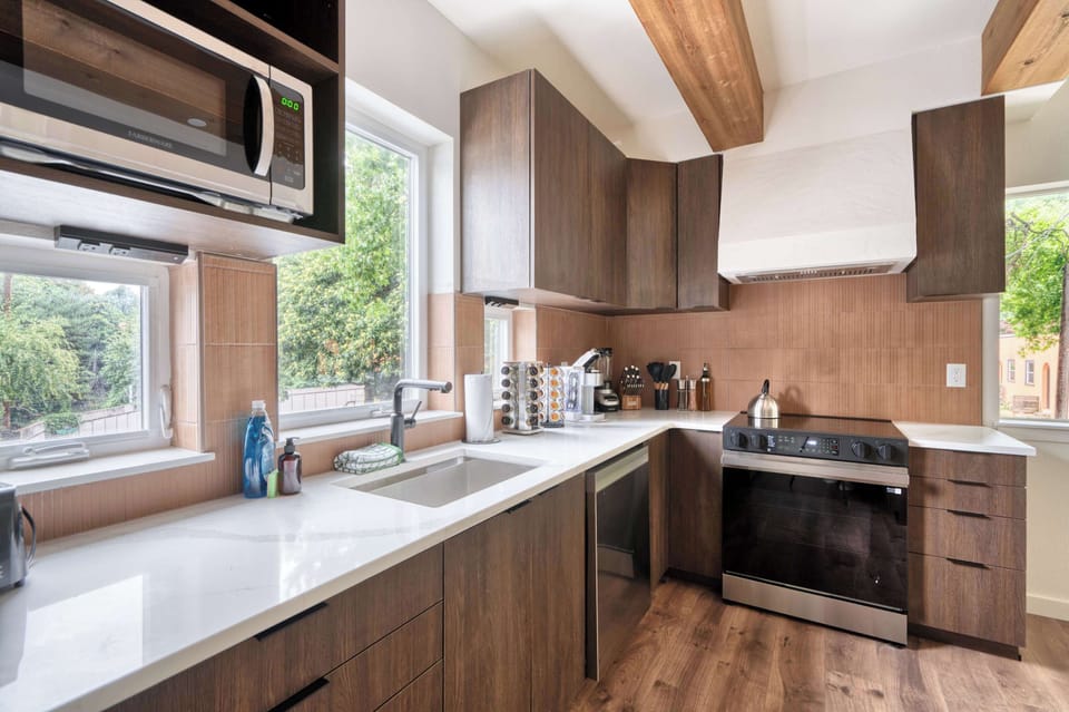 Kitchen with sink and wood cabinetry.