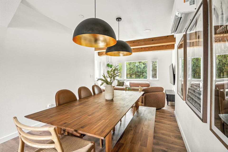 Dining room with table and wall art.