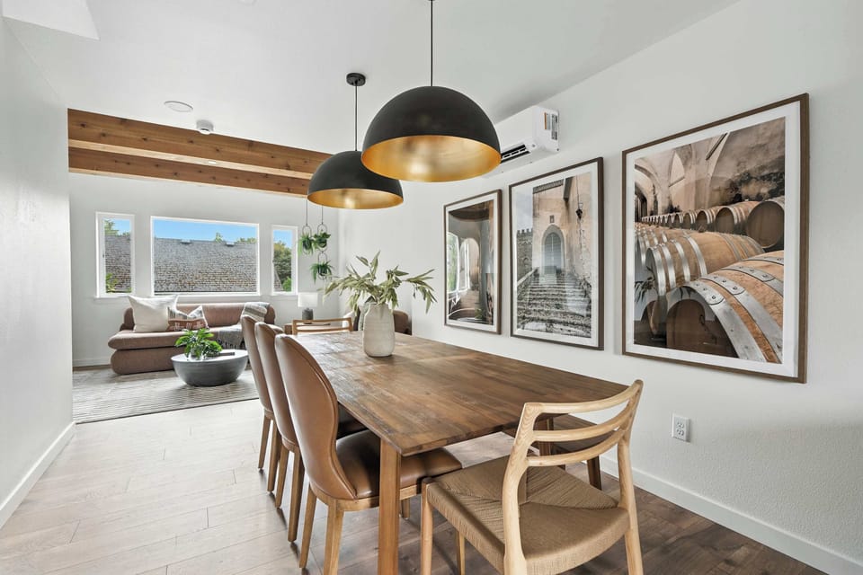 Dining room with table and wall art.