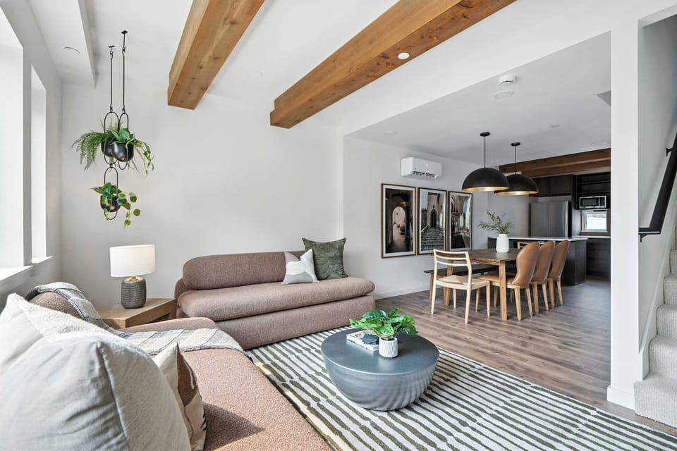 Living room open to dining and kitchen.