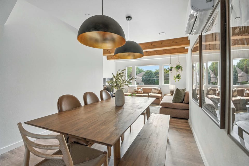Dining room with table and kitchen view.
