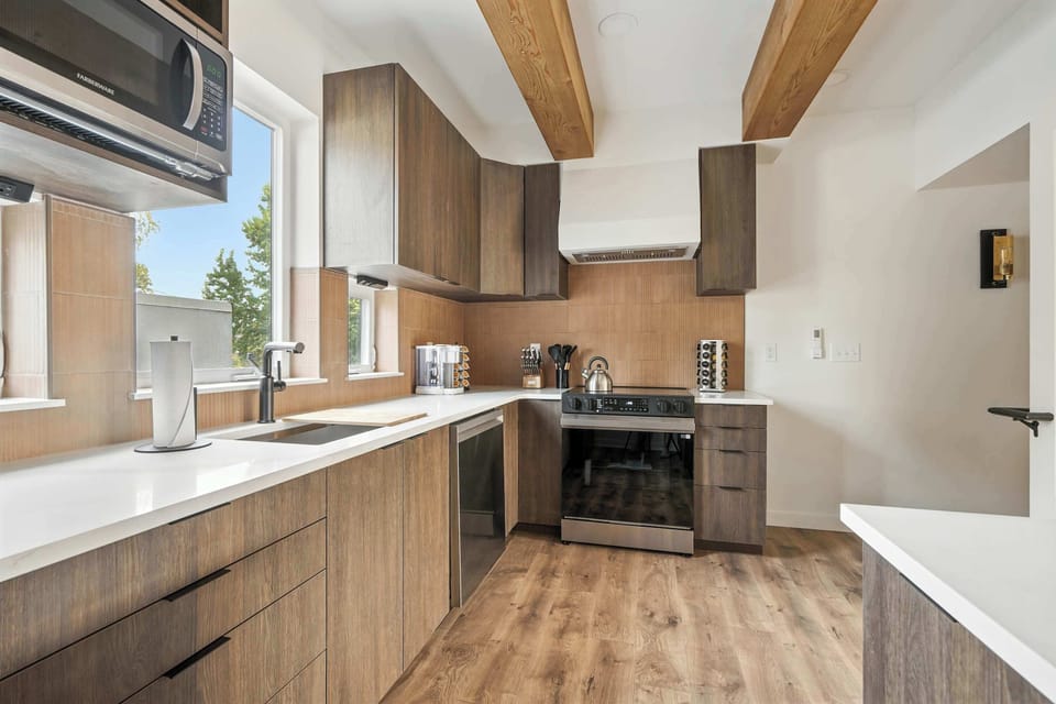 Kitchen with sink and wood cabinetry.