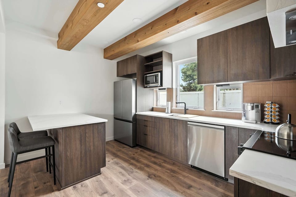 Kitchen with stainless appliances and island.