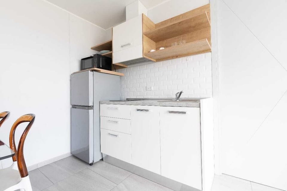 Apartment, City View | Private kitchenette | Microwave, stovetop, electric kettle, cookware/dishes/utensils