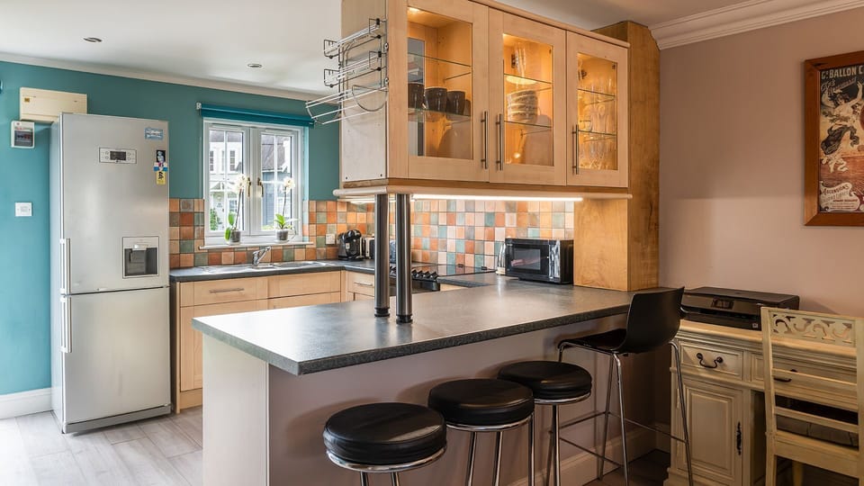 You start in the kitchen which is very well-equipped for your stay.