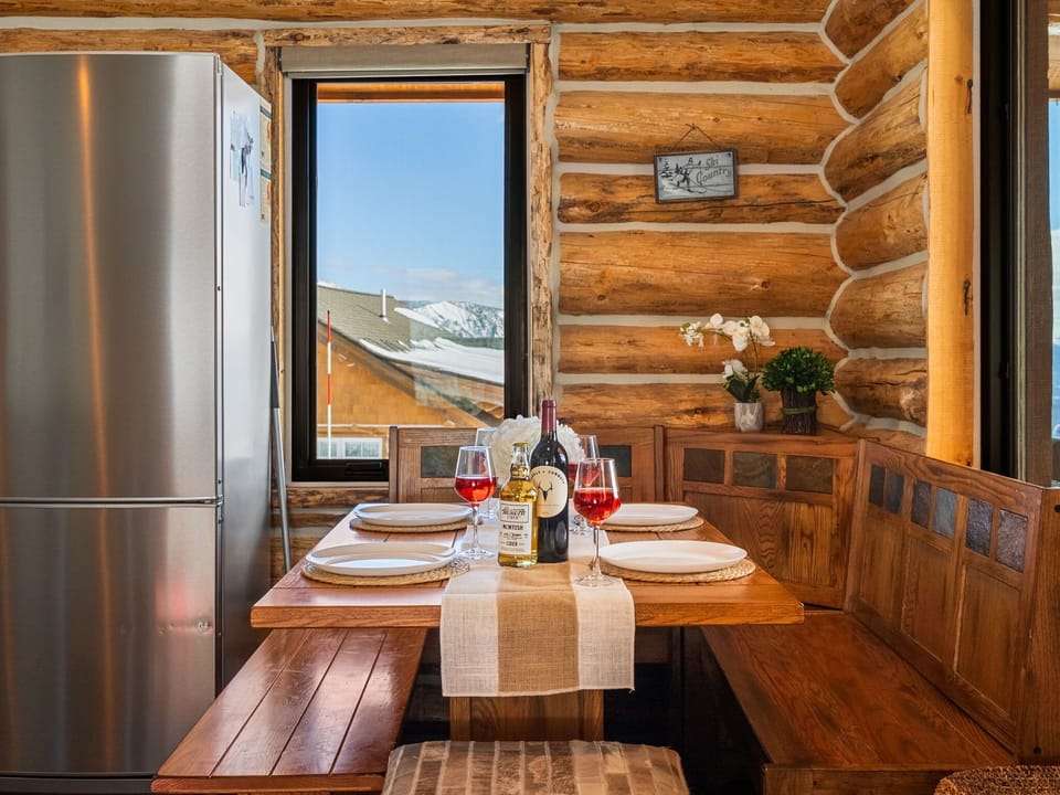 Dining area: Table seating for 5, adjacent to kitchen