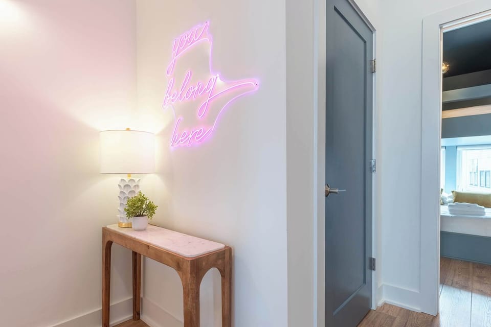 Welcome to your Nashville oasis! This chic entryway with a vibrant You Belong Here neon is perfect for family reunions or corporate retreats. Unwind and embrace the elegant ambiance of Music City!