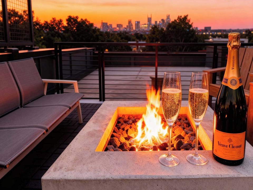 Champagne at sunset on the rooftop fire pit, Nashville's skyline turning pink behind you, is the moment your group getaway becomes unforgettable