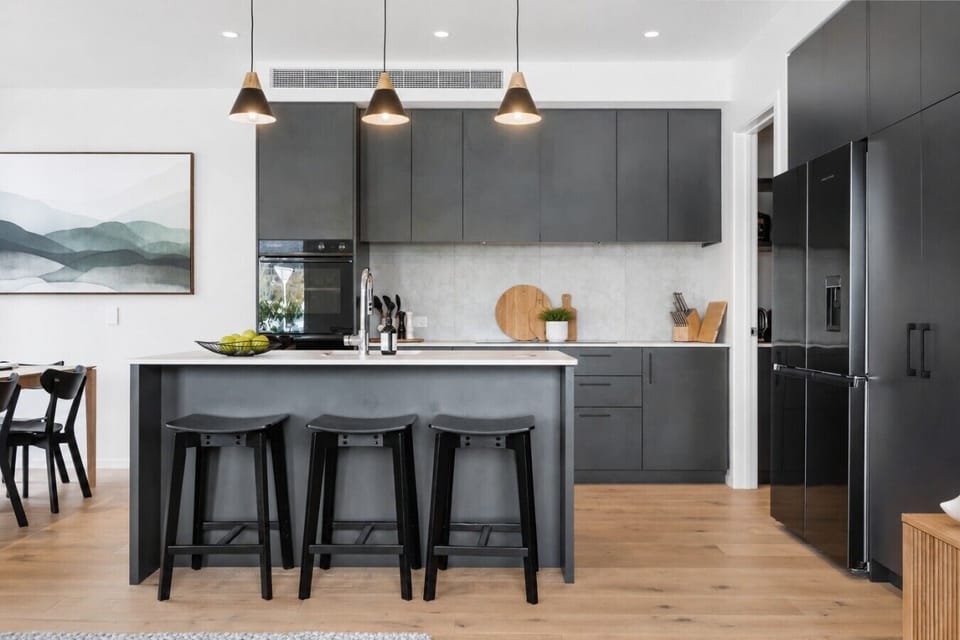 Pull up a stool at the generous island - grab breakfast, pour coffee, or stay and chat while someone cooks. This kitchen is the heart of the home