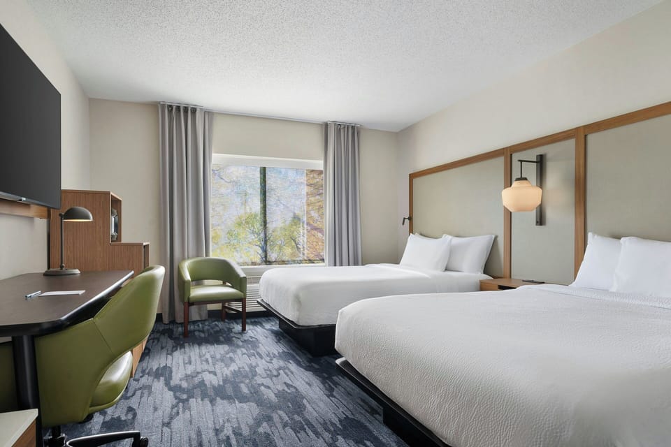 Premium bedding, desk, laptop workspace, soundproofing