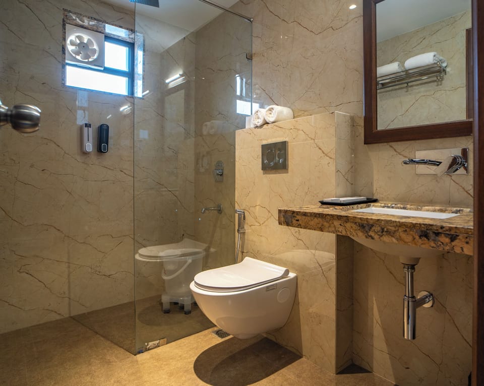 Shower, free toiletries, hair dryer, slippers