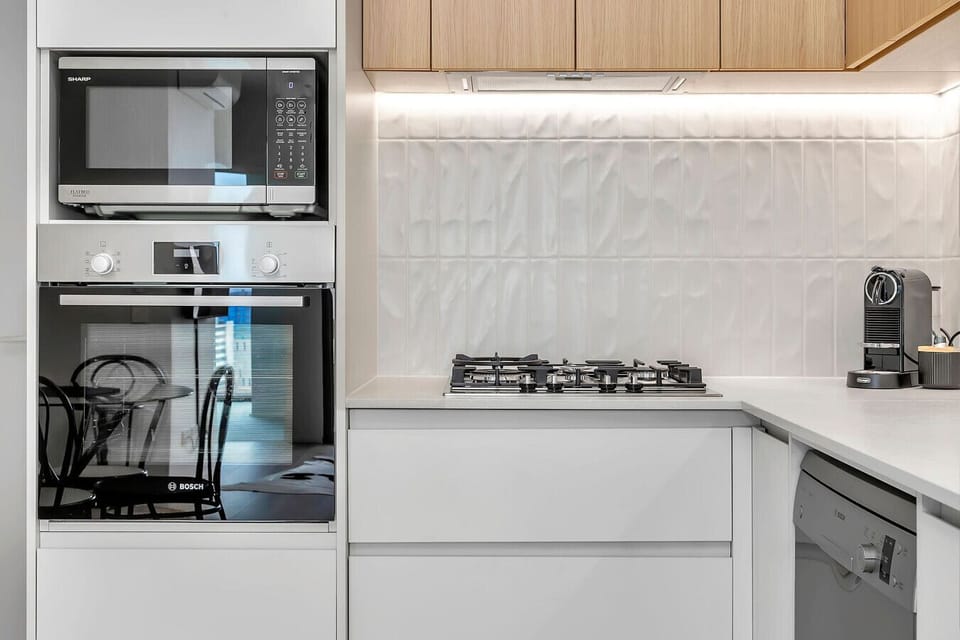 Bright, open-plan dining area adjacent to a modern kitchen.