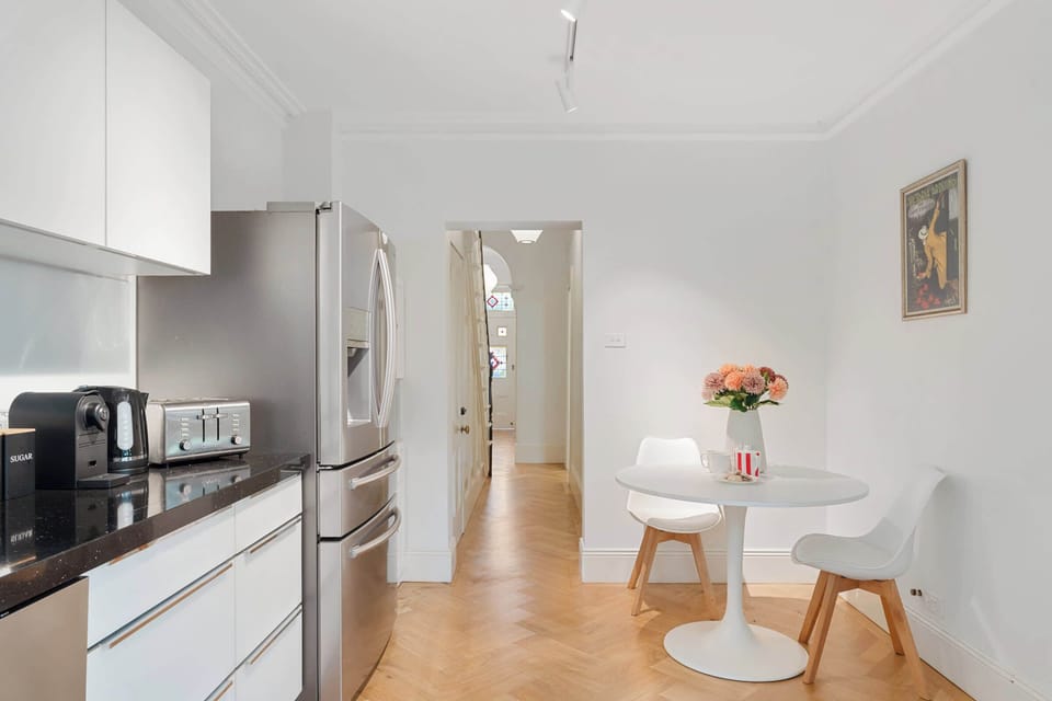 The modern kitchen comes fully equipped with everything you need for effortless cooking and entertaining. It offers direct access to the alfresco area, as well as a conveniently located bathroom, blending practicality with contemporary style.