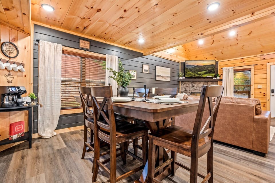 Enjoy breakfast or dinner in this cozy cabin setting.
