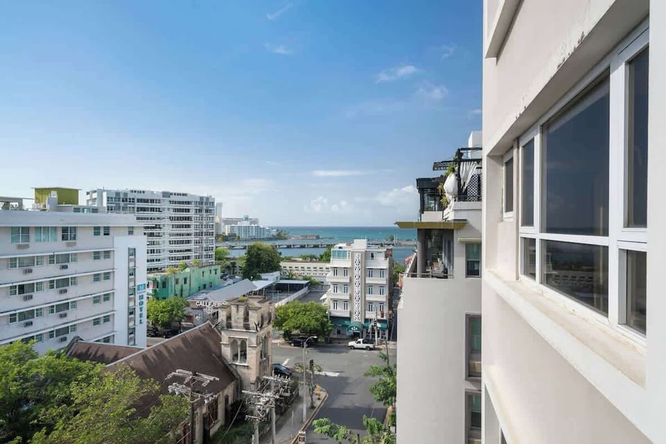 Enjoy the vibrant city life from your private balcony, offering a refreshing view of the surrounding architecture and a glimpse into the local ambiance.