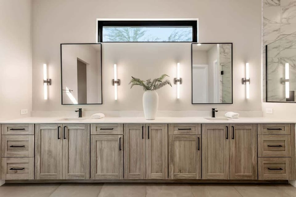 Primary bathroom with double vanities, large walk-in shower, soaking tub, and large walk-in closet.