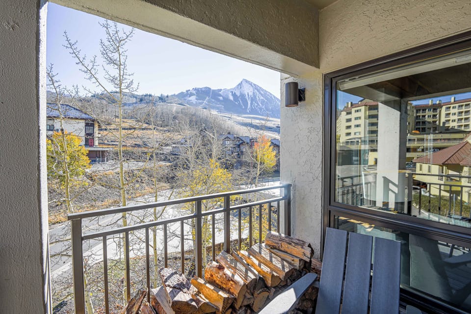 【Private Balcony】Two chairs pointed at Mt Crested Butte — check ski conditions from your coffee