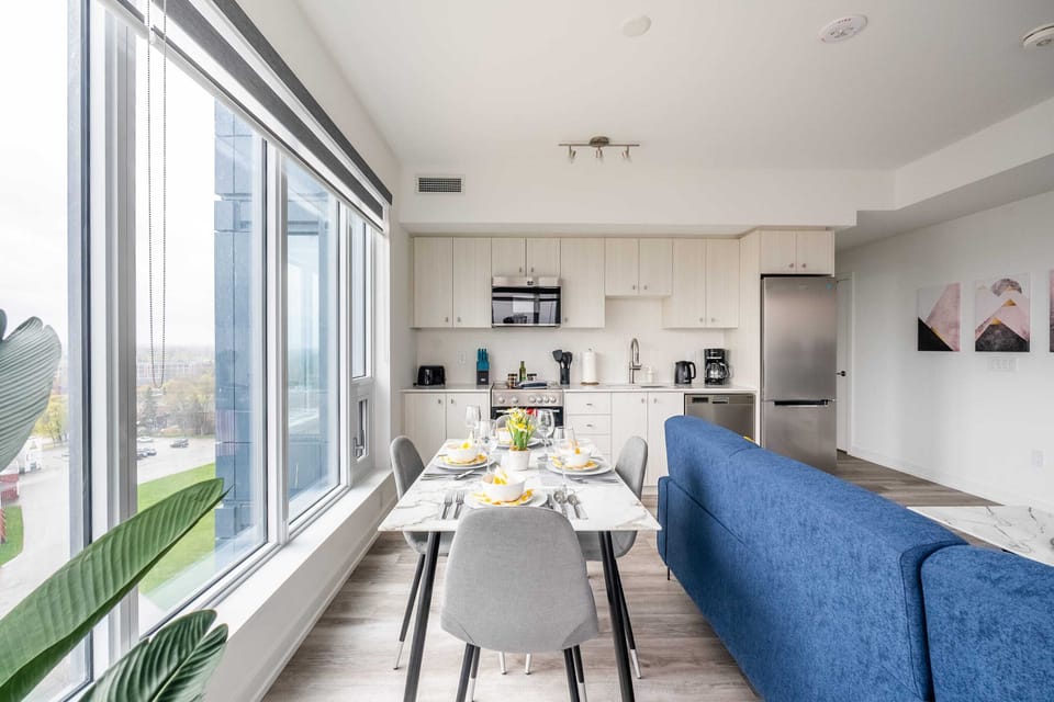 Spacious Layout Featuring Dining Area With Floor-To-Ceiling Windows And City Views