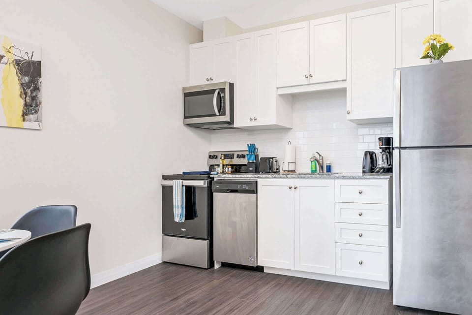 Fully equipped kitchen with silver appliances