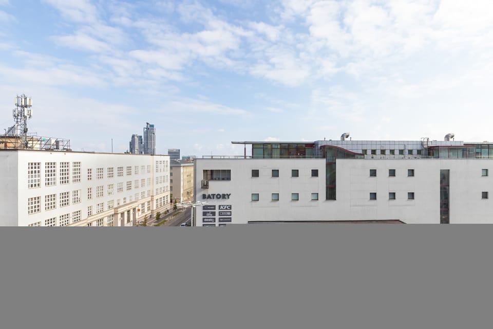 The balcony's stylish design complements the apartment's decor.