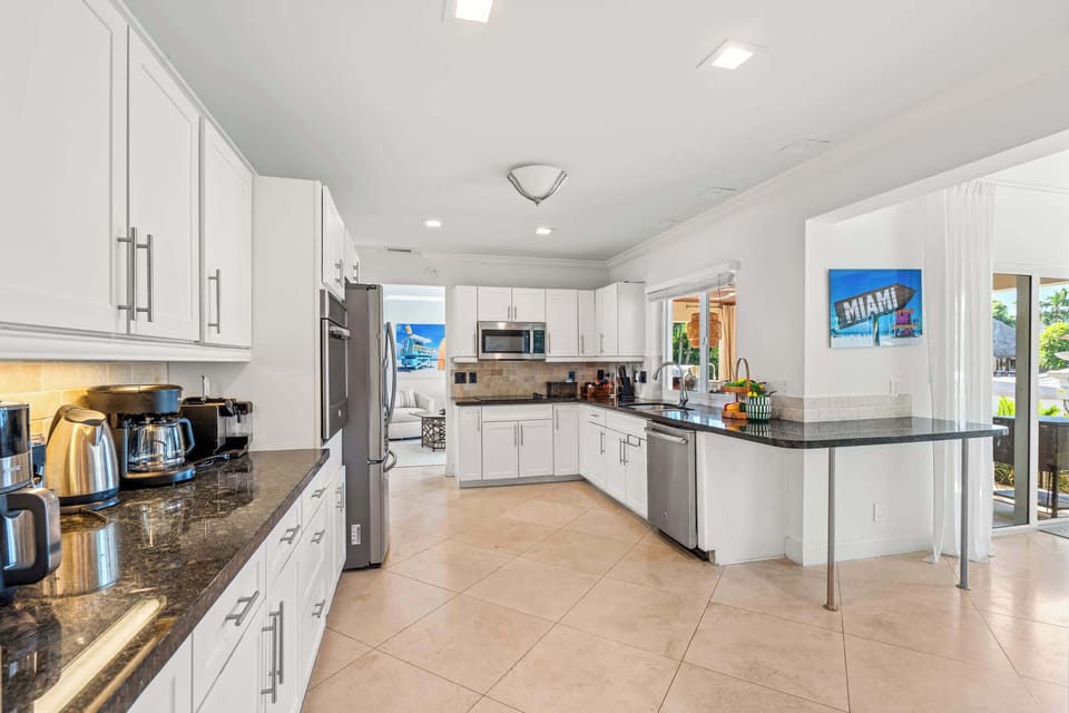 The kitchen has a Keurig and a regular coffee maker