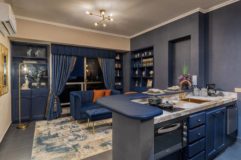 Superior Studio Suite, City View, Blue Mystery | Private kitchen | Coffee/tea maker, griddle, cleaning supplies