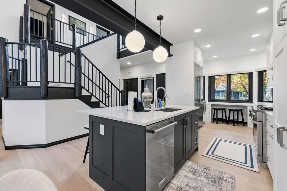 Elegant, open concept living flooded with natural light
