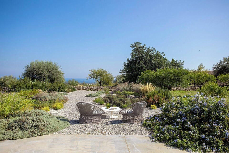 The gravel section of garden with its al fresco sea-view sitting area.