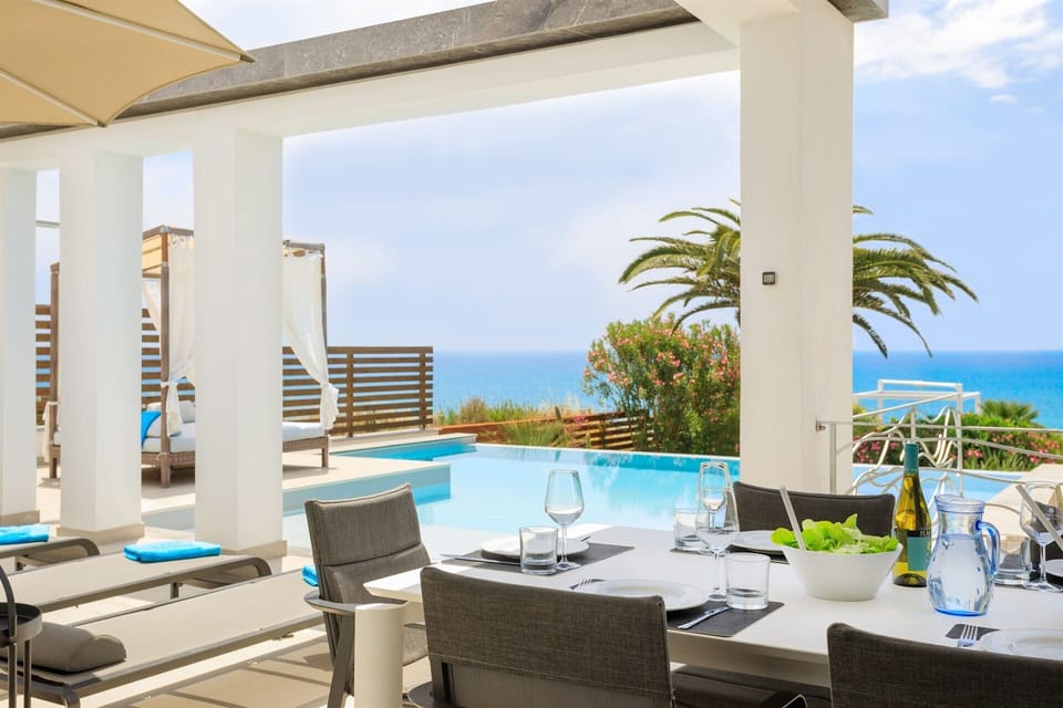 The kitchen opens out to the al fresco dining area, which has views of the sea.