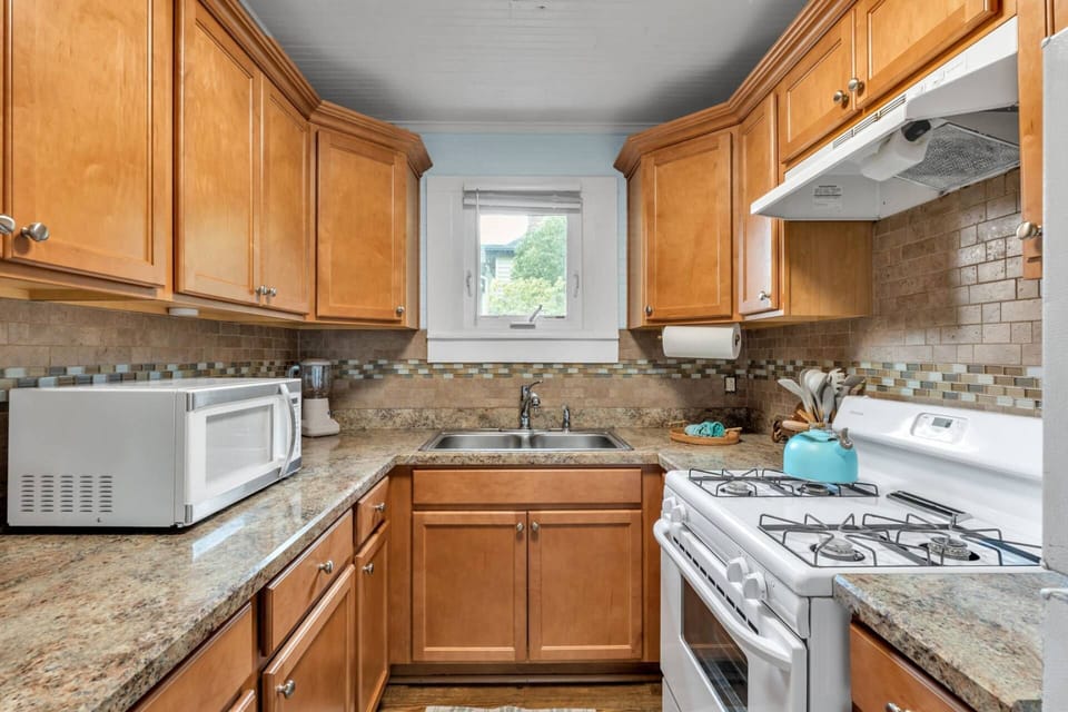 Gas range, microwave, refrigerator, Keurig pod coffee maker, toaster oven & blender.