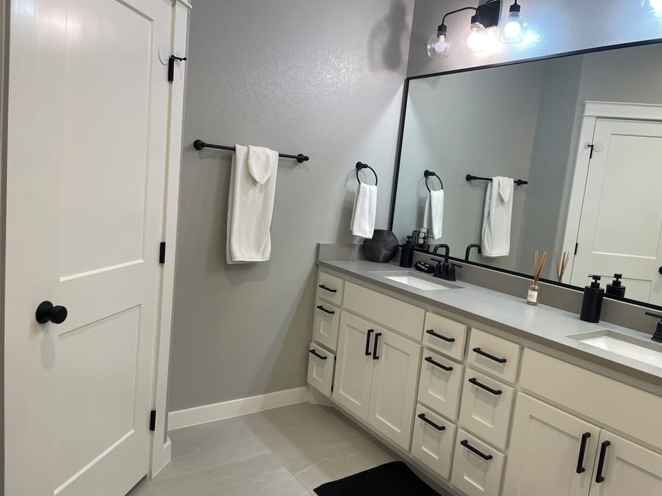 Master bath with private toilet area behind the door. Master closet as well.